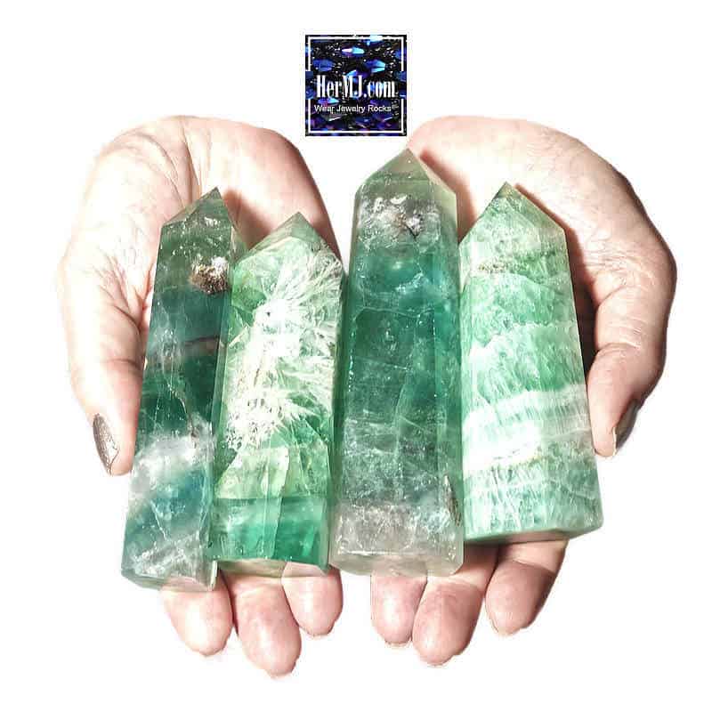 Green Crystal Tower Collection From HerMJ - Held In Hands. Showcasing natural gemstone decor and healing stones for decor and meditation.