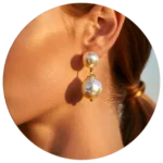 Pearl drop earrings on ear