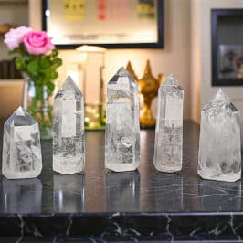 Clear quartz gemstone towers for jewelry making, healing and spiritual practices, showcasing natural transparency, unique internal inclusions, and radiant crystals perfect for adornment and energy work.