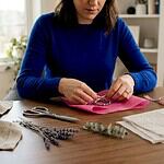 Woman wrapping handmade jewelry gift