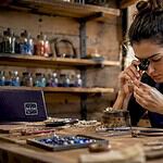Jewelry artisan setting gemstone precisely