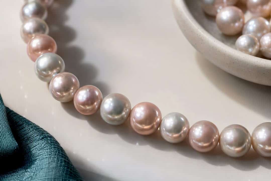 Pearl Colors Meaning: 5 Pearl Color Clusters and When to Wear Pearls showing mixed rose and silver overtones