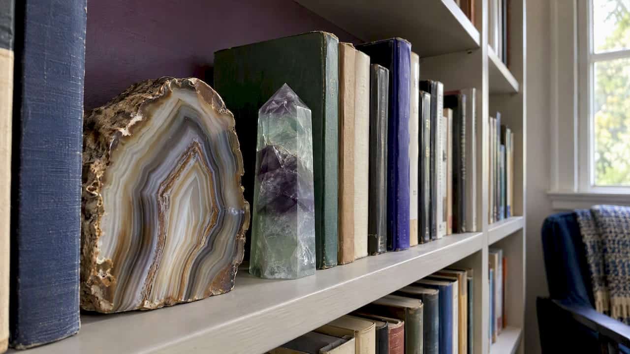 Gemstone Bookshelf Styling: A Designer's Guide Agate and fluorite interrupt rows of books